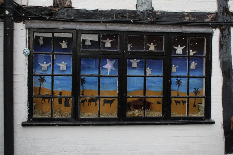 The first Advent window, inspired by the carol “O Come All Ye Faithful” was unveiled at The Wheatsheaf