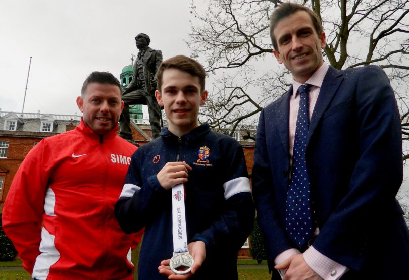 Shrewsbury School pupil Will Cowper, centre, who designed the medal runners taking part in the Mercedes-Benz of Shrewsbury 10K will receive, with, left, Simon Macdonald, director of event organisers Ultimate Fitness Experience, and Peter Middleton, Deputy Head (co-curricular) at Shrewsbury School