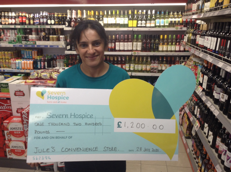 Julie Duhra with the £1,200 cheque for Severn Hospice