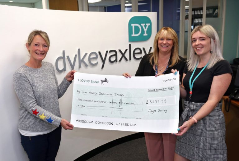 Sally Johnson from The Harry Johnson Trust is handed the cheque from Jackie Young and Mel Edwards of Dyke Yaxley