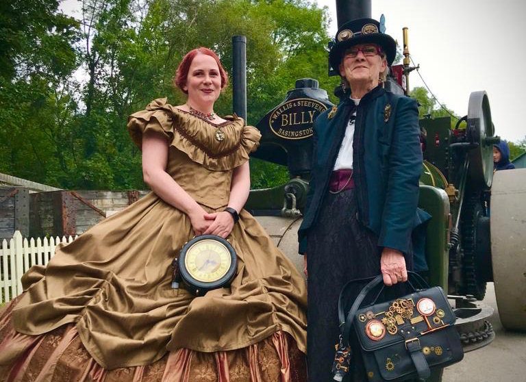Two women from the Black Country Steampunk Society met Billy the steam roller at the steam weekend
