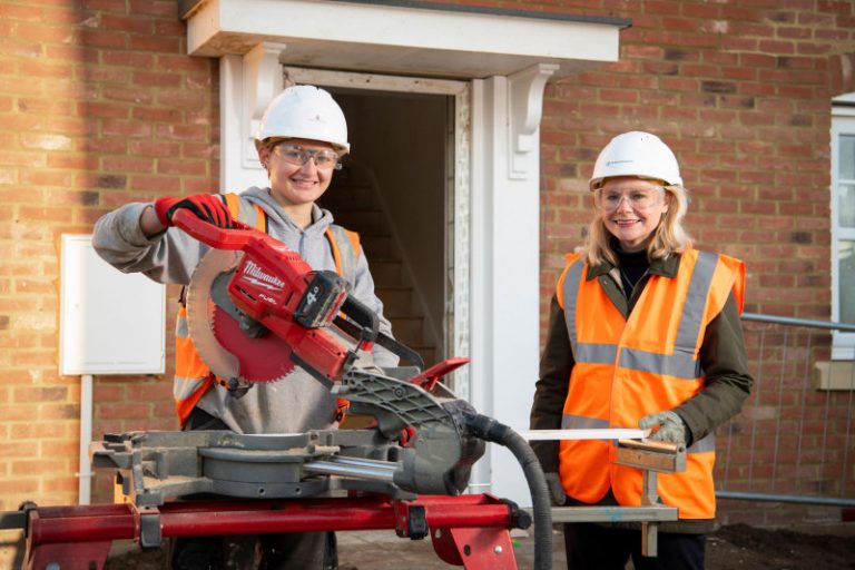 Justine Greening with Persimmon apprentice Katie