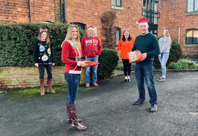 The team at Shropshire Rural Housing Association presenting some of the treats to Rhea Alton, of The Friends of Oakmeadow School.