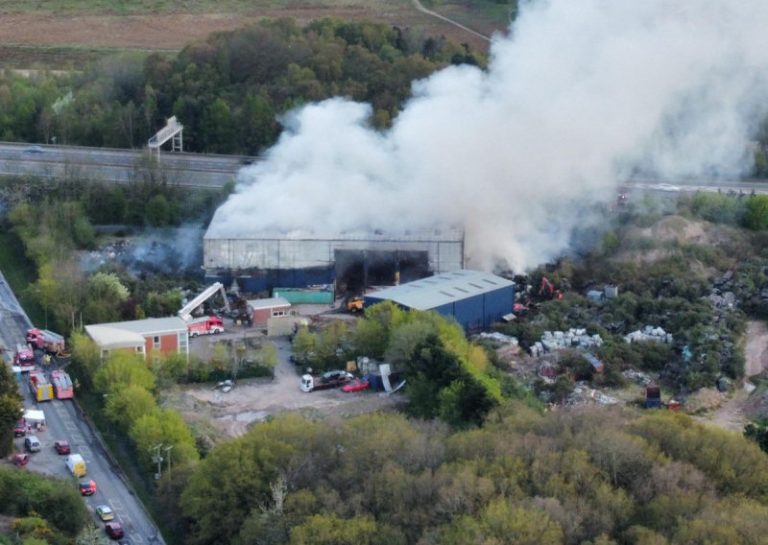 Smoke continues to rise above the scene of the fire at a waste recycling centre in Telford. Photo: James Griffiths