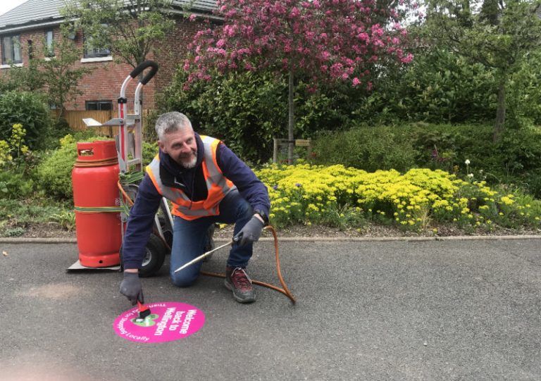 Kevin Pilsbury putting one of the stickers down