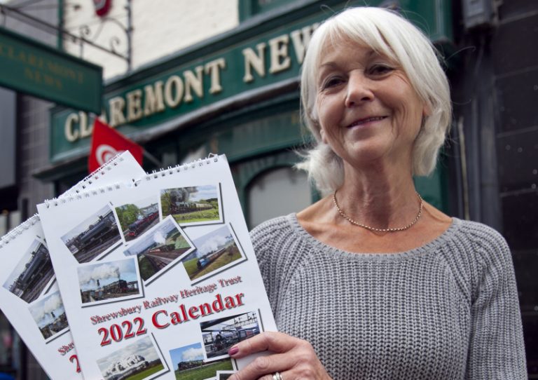 Val Woodvine of Claremont News with the 2022 calendar
