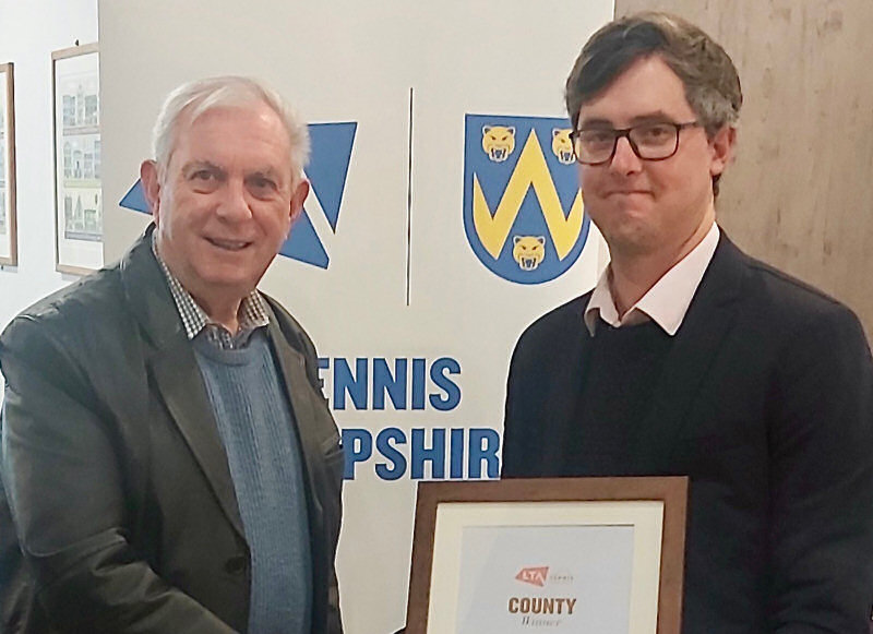 Andrew Hawke, right, received the club of the year award for Wem Tennis Club from Tennis Shropshire president Keith Smith