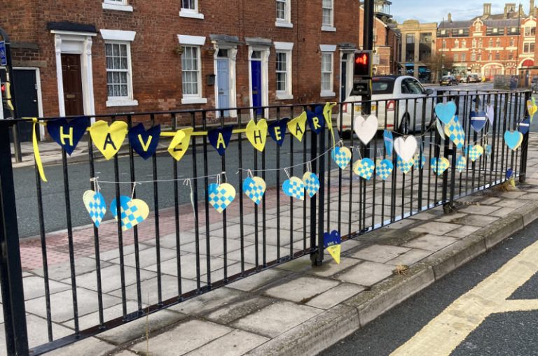 Blue and yellow hearts have been hung outside the MP’s offices emblazoned with the message “Have A Heart”