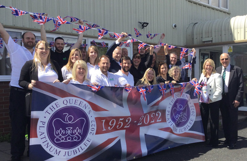 The Seymour Manufacturing International team flying the Jubilee flag at their headquarters on the Stafford Park industrial estate in Telford