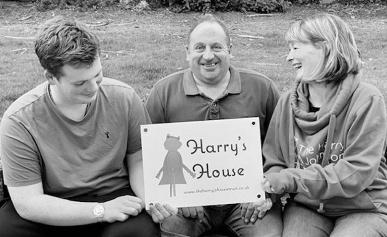 Pictured are Harry’s parents, Stephen and Sally Johnson, and his brother Eric