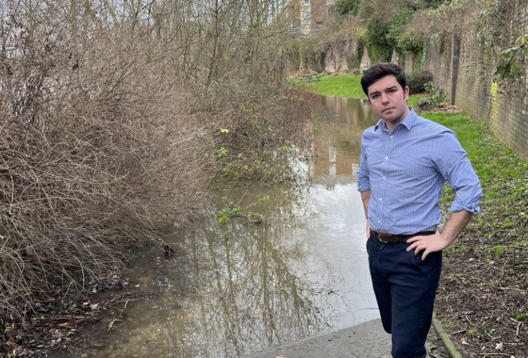 Councillor Alex Wagner pictured at the Pig Trough in Coton Hill during flooding