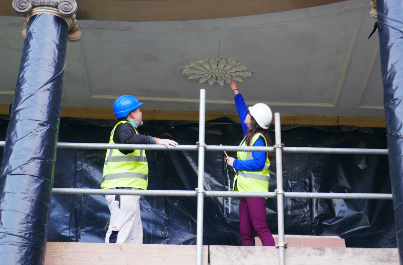 Building Surveyor Rachael Parry and painter Rob Dell looking at the plasterwork. Photo: ©National Trust