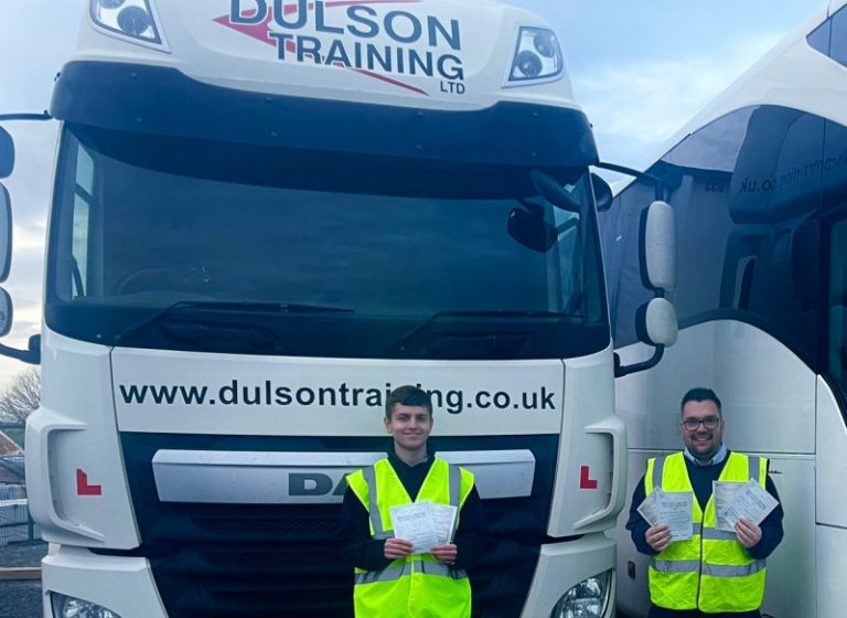 Jed Norgrove (Cat C+E) on the left and Josh Hazell (Cat C+E and D+E) displaying their DVSA vocational test pass certificates