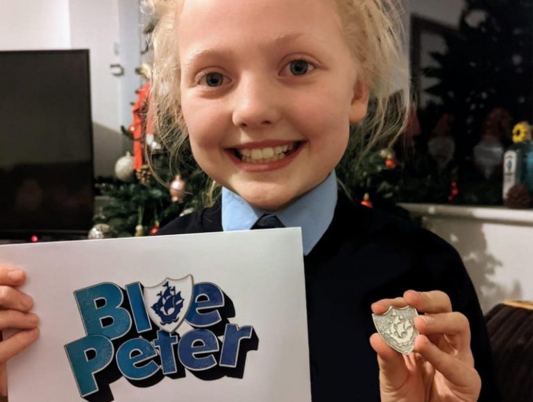 Ruby Sheffield with her silver Blue Peter badge