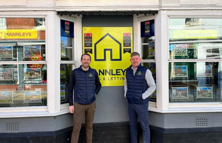 Directors of Mannleys Estate Agents Chris Mann and Aaron Manley outside the building now owned by the firm in Market Street, Wellington