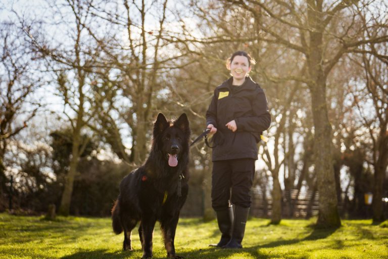Two-year-old Soot is pictured with Canine Carer Becky Rogers