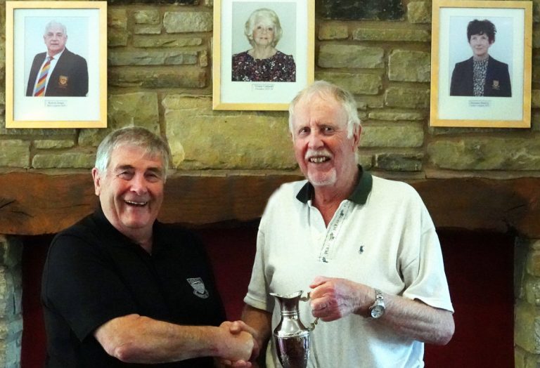 2023 Seniors Captain, Dave Gough presenting the Bob Fielding Memorial Trophy to Bob Baker