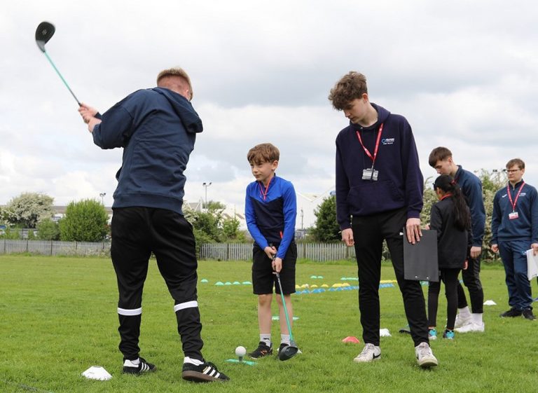 Charlie Anson and James Baker working with the students