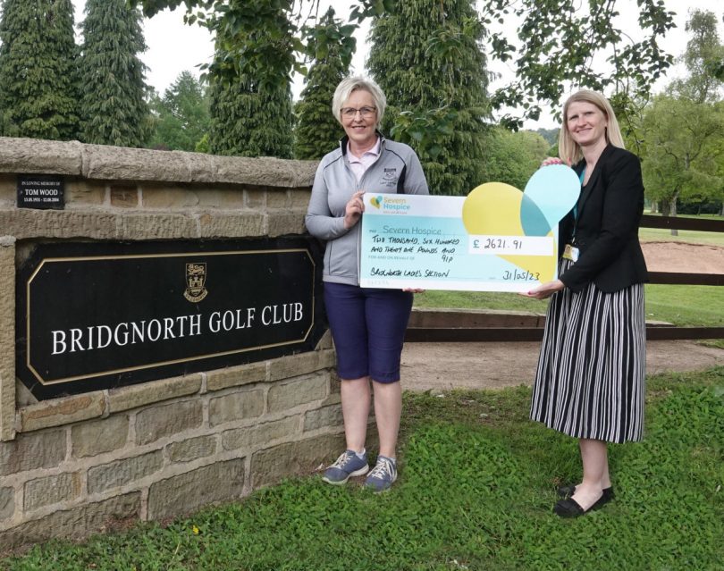 Ali Grove 2022 Ladies Captain, handing her cheque to Nicky Green, Senior Community Fundraiser for Severn Hospice