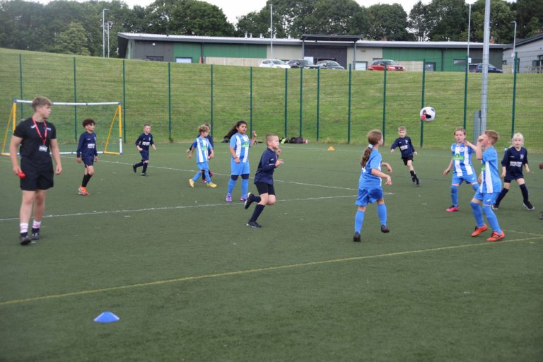 Primary schools in football action on Telford College’s 3G pitches, officiated by the college’s sports students