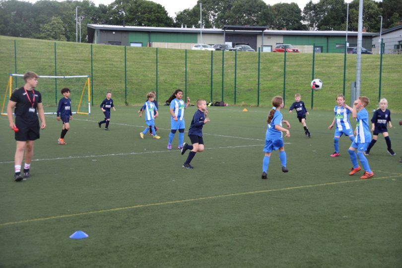 Primary schools in football action on Telford College’s 3G pitches, officiated by the college’s sports students