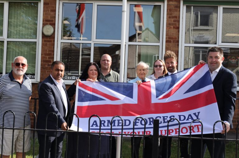 Great Dawley Town Councillors raising the Armed Forces Day flag outside Dawley House. Pictured are Cllrs Chris Turley, Raj Mehta, Corrine Chikandamina, Ben Carter, Barry Parnaby, Erin Aston, Ian Preece, Shaun Davies