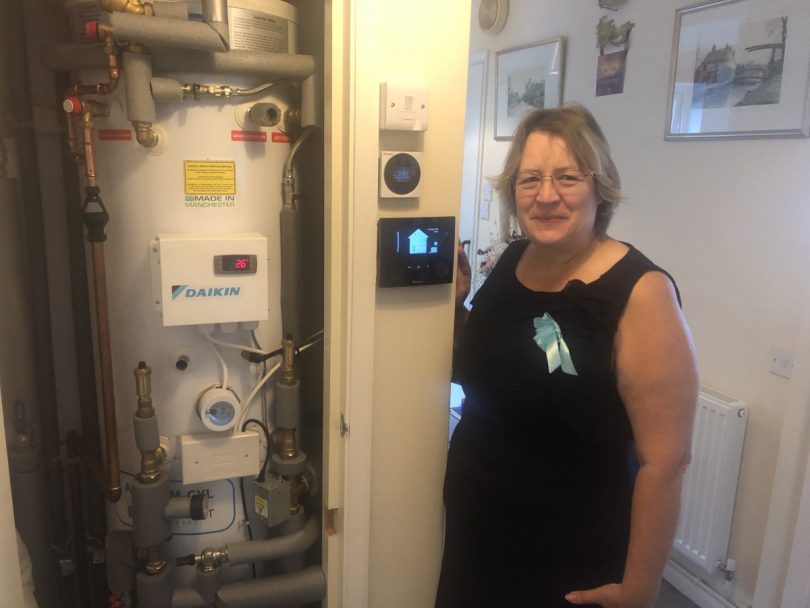 Resident Wendy Mole with the new energy-efficient boiler