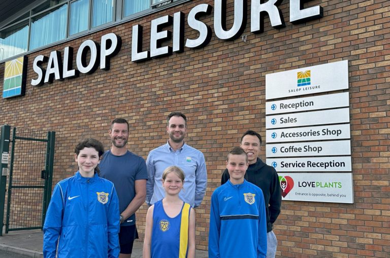 Salop Leisure’s marketing manager Ed Glover (centre back row) with coaches and young athletes from Shrewsbury Athletics Club