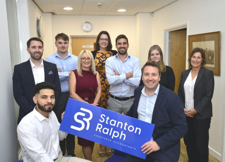 Philip Wood (front right) and Ann Hill (centre) and just a few of the team members with the company’s new brand