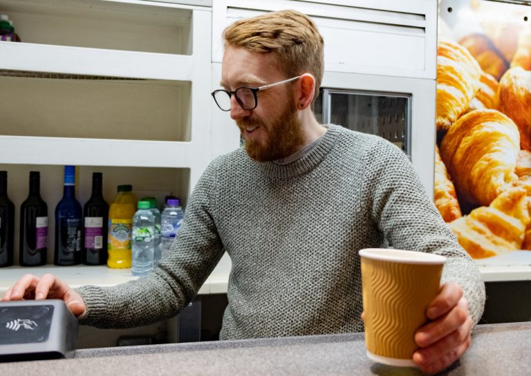 Volunteer Richard Howell serving coffee