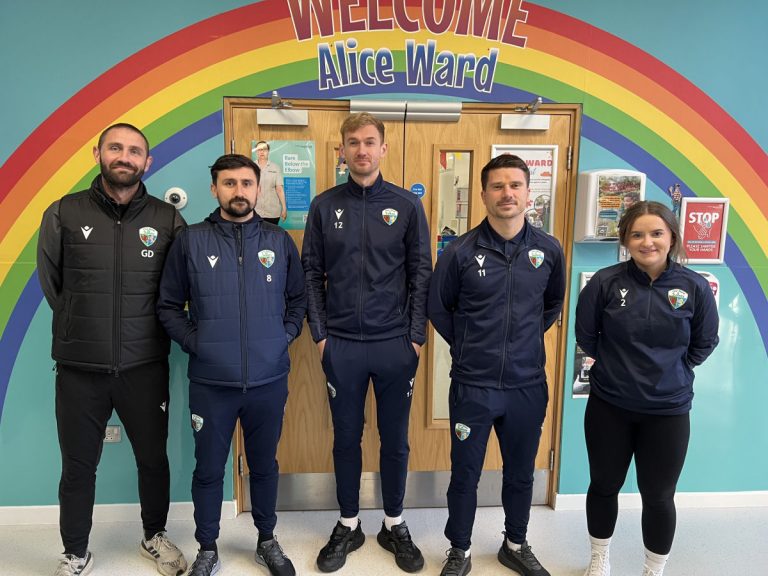 The New Saints players and staff handed out Christmas gifts