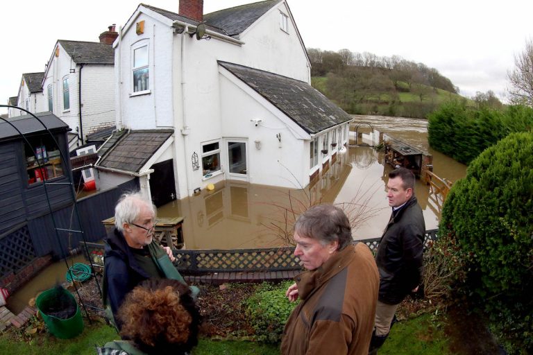Philip Dunne MP, pictured with Stuart Anderson, Jackie DesaiGale and Terry Gale during recent flooding in the county.