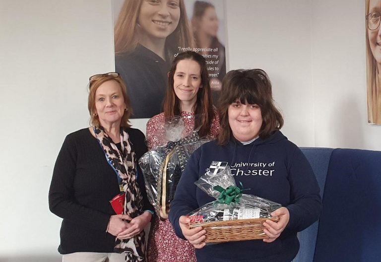 Charlotte Brookes (centre) and Laura Morris (on right), students on the BA Events and Festivals Management degree course at University Centre Shrewsbury, with Fiona Warburton, Programme Lead, and prizes donated by Shrewsbury businesses for the silent auction at The Shrewsbury Spring Fling charity ball in aid of Macmillan Cancer Support, in March 2024.