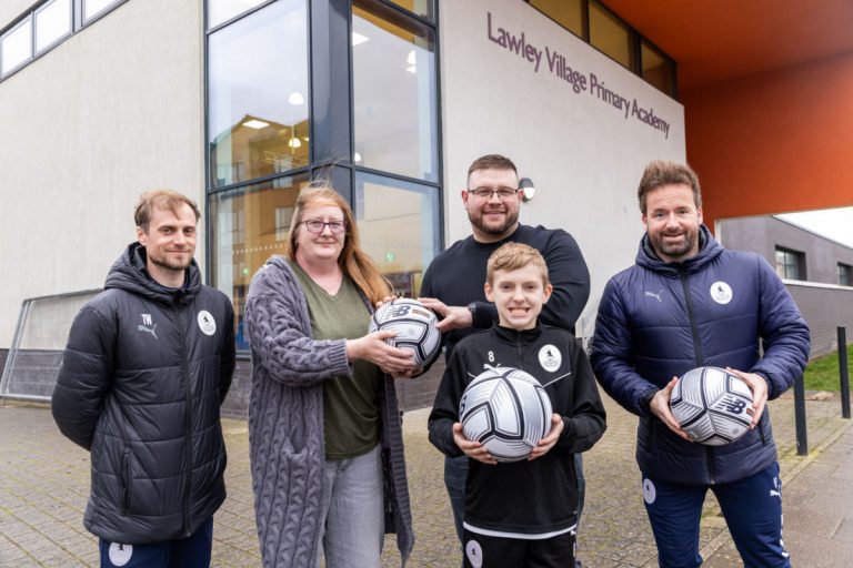 Ward councillors for Lawley, Erin Aston and Luke Lewis, with Tom Wellings AFC Telford United Foundation Manager, far left, and Ian Preece AFC Telford United Foundation Director, far right, with Jack Turner. Photo: Telford & Wrekin Council.
