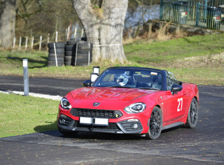 Club member Mary Elliott, of Shrewsbury, who shares this Abarth 124 Spider with husband Hugh, at Loton Park