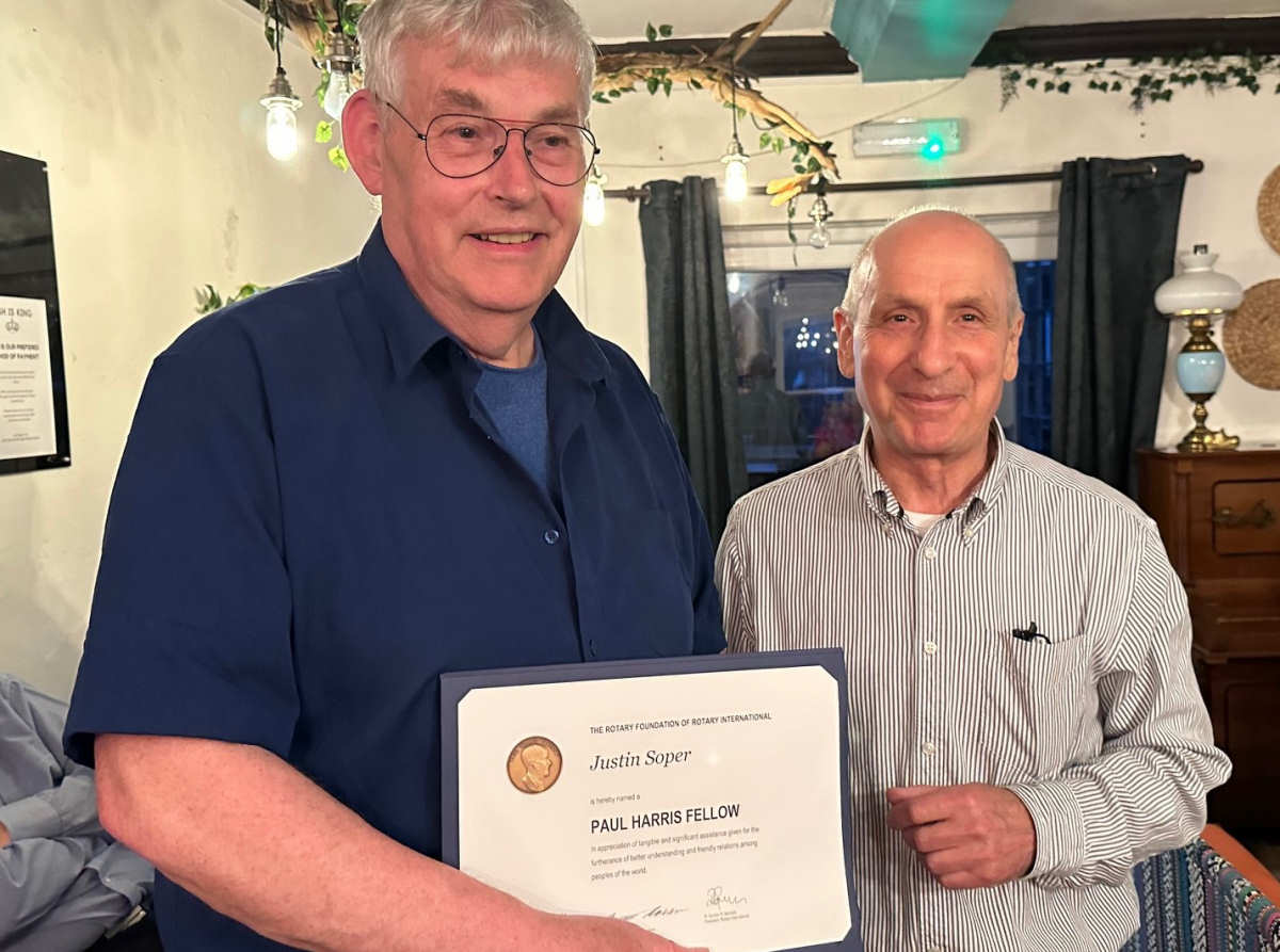 Justin Soper is pictured being presented with the certificate by Andy Boroughs the Borderland Rotary President. Photo: Chris Bryan-Smith.