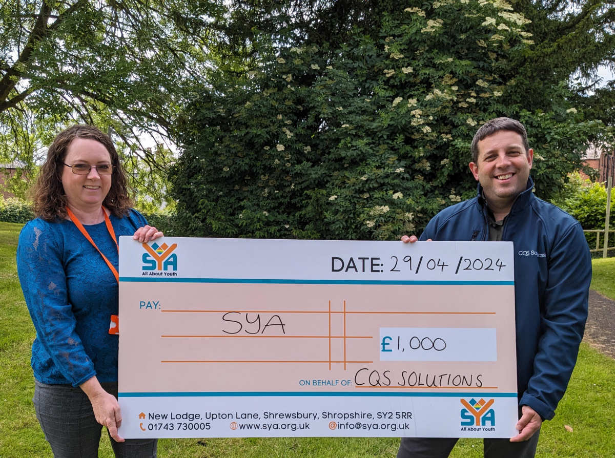 Claire Purcell, of Shropshire Youth Association and Tim Lloyd of CQS Solutions with the £1,000 donation