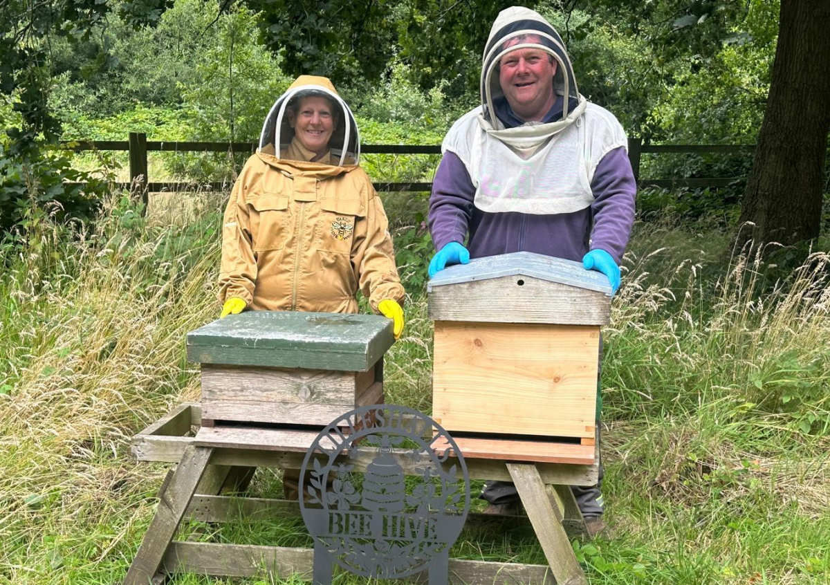 Jennifer Sibbald-Wall, Contract Manager for Lilleshall pictured with local beekeeper Steve Haseley