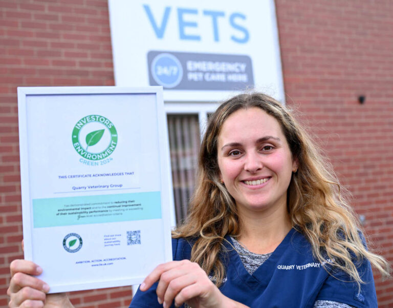 Charlie Hertel with the Green Investors in the Environment certificate