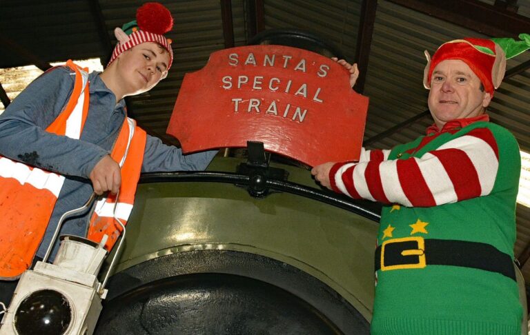 CHR Volunteer Harrison Gillham alongside Santa Helper David Roberts gearing up for the Cambrian Santa Specials