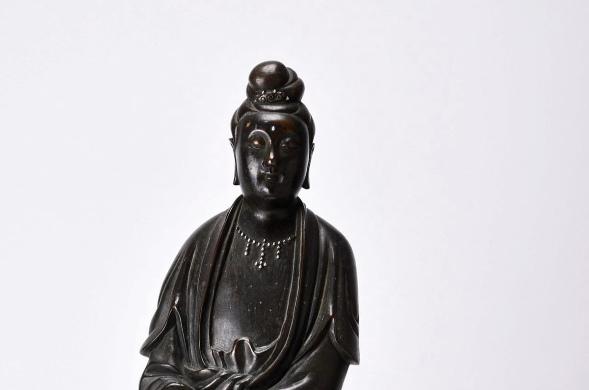A rare Chinese silver-inlaid, bronze figure of Guanyin