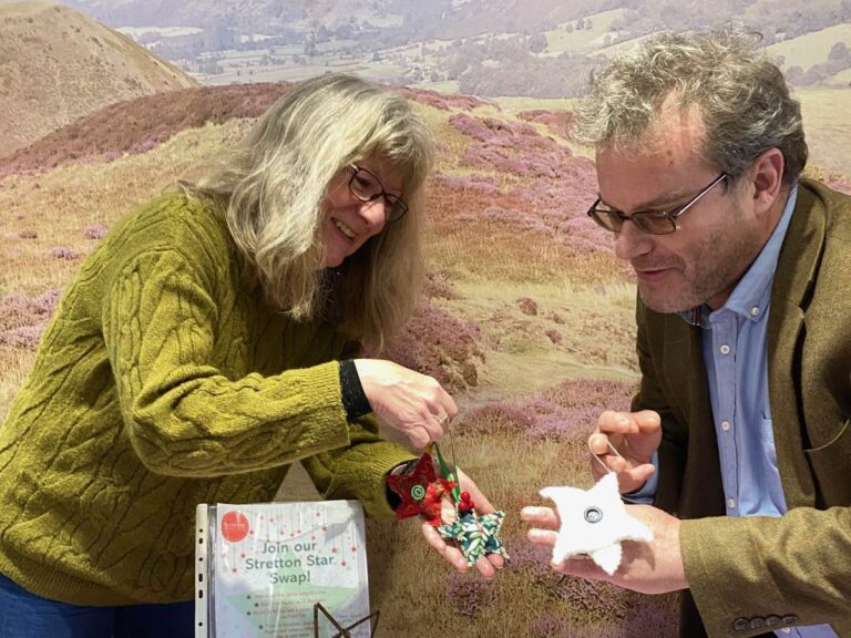Mayfair volunteers Anne and David with a collection of the stars that have been created for the ‘Stretton Star Swap’