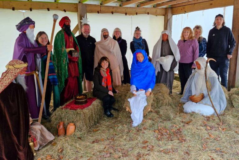 Councillor Angela McClements (centre) with other guests at the unveiling of the nativity scene