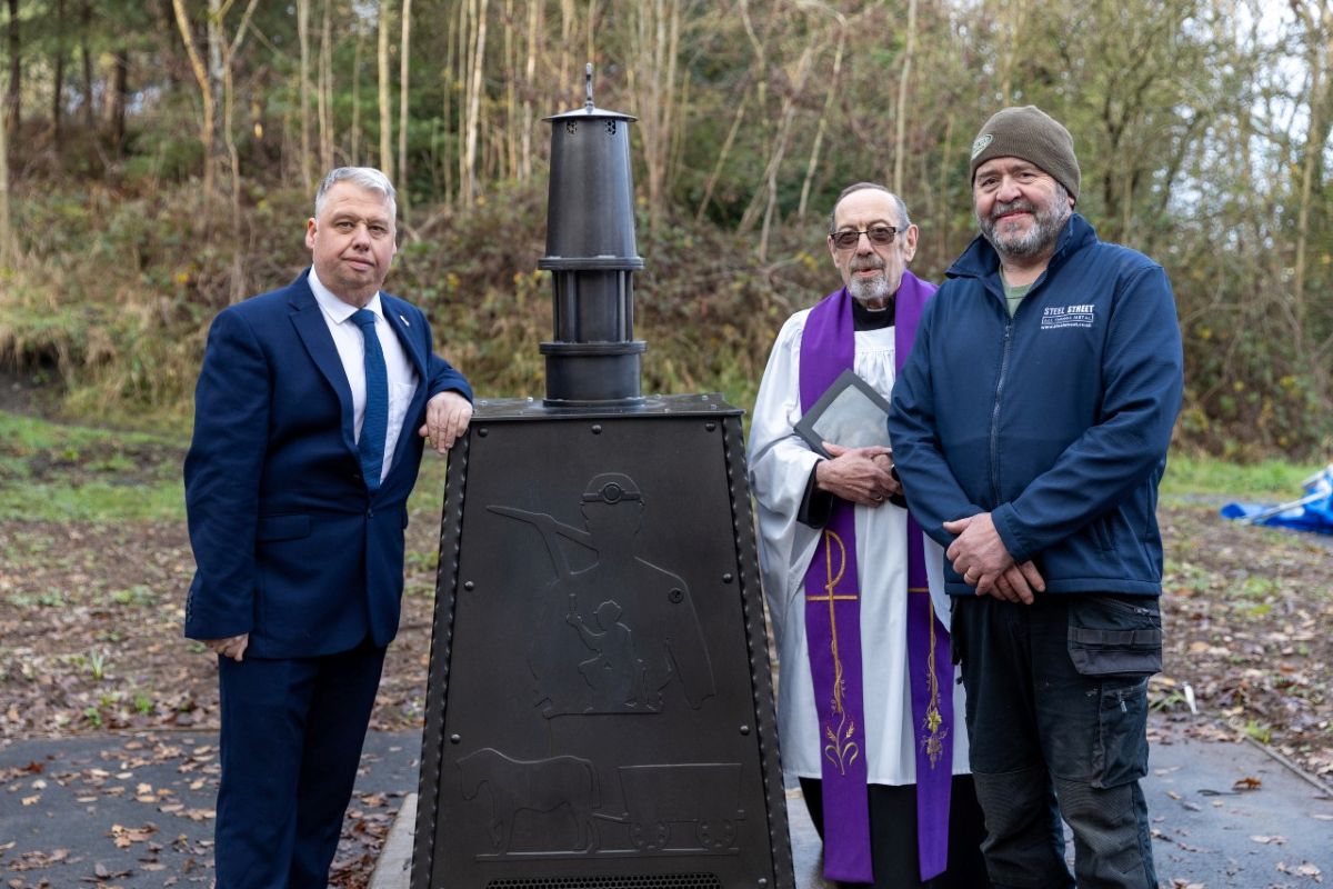 Councillor Richard Overton, (Lab) Deputy Leader of Telford & Wrekin Council and St Georges ward councillor, the Reverend Richard Walker Hill and Trevor Bates from Steel Street, with the memorial which recognises the area’s industrial past. Photo: Telford & Wrekin Council
