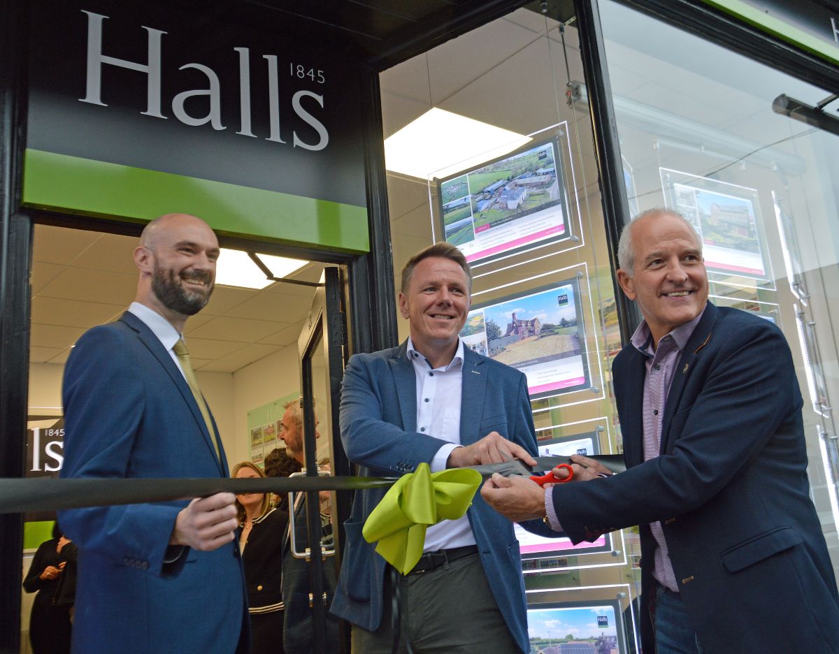 Halls’ managing director Jon Quinn (centre) with manager Matt Gilbert and ex-Wolves and England striker Steve Bull at the opening of the company’s Telford branch last year