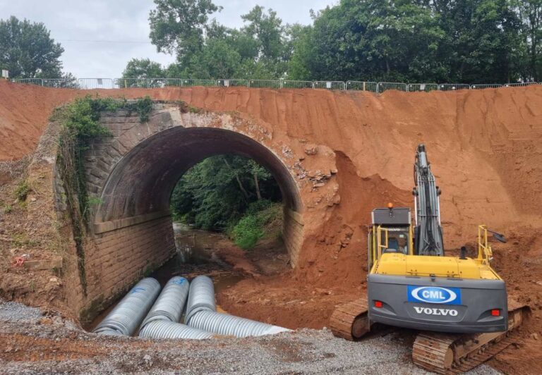 Work takes place to install the temporary culvert for the water course. Photo: Chris Bond