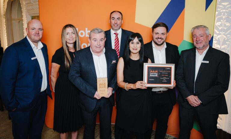Telford College trio Sarah Davies, Jon Aver and Aneeta Hazir, receive the award with some of the college’s training partners. Photo: WMCA