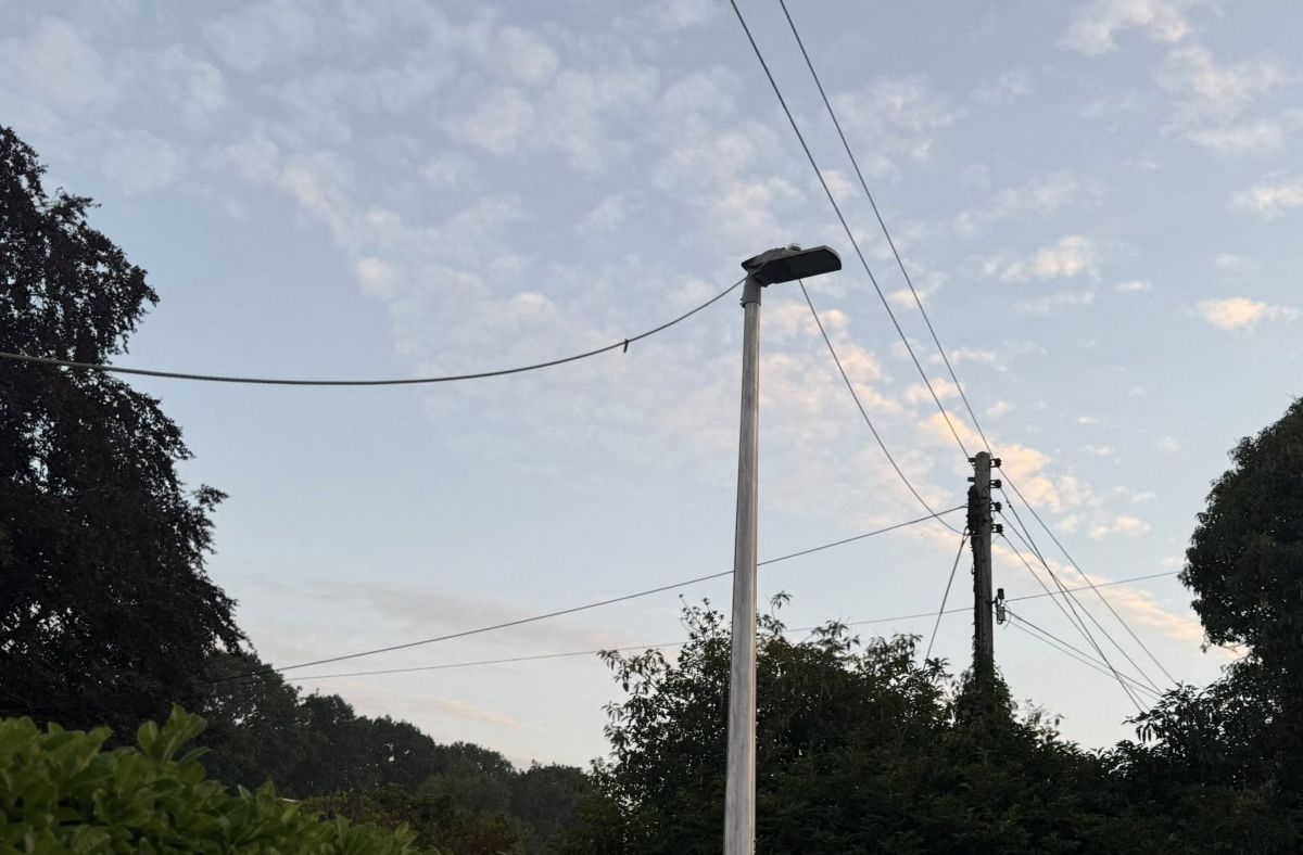 A power cable can be seen resting on a street light. Photo: Shropshire Fire and Rescue Service