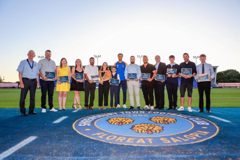 Winners line up with Shrewsbury Town player Luca Hoole 