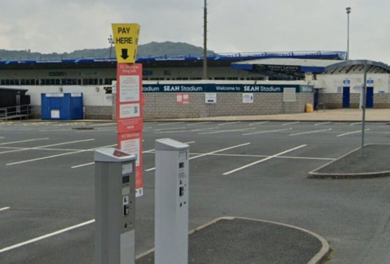 Fake QR codes were placed on parking signs at the SEAH Stadium. Image: Google Street View